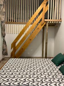 a loft bed in a room with a staircase at Alzira bonita Habitación verde con baño privado in Alzira