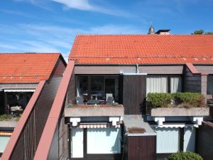 an external view of a house with an orange roof at Traumblick in Sankt Andreasberg