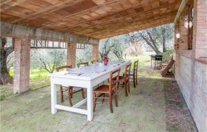 a white table with chairs sitting under a pavilion at Lovely Apartment In Volterra With Wifi in Volterra