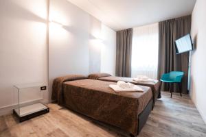 Katil atau katil-katil dalam bilik di Hotel Ciclamino