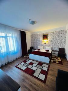 Voodi või voodid majutusasutuse Hotel Suprem toas