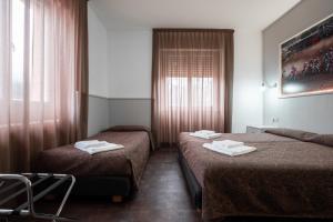 Katil atau katil-katil dalam bilik di Hotel Ciclamino