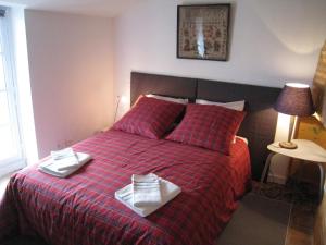 Cama o camas de una habitación en Le Logis des Tourelles