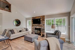 a living room with a couch and a fireplace at Lessons from Mars in Banner Elk