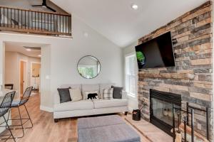 a living room with a couch and a fireplace at Lessons from Mars in Banner Elk