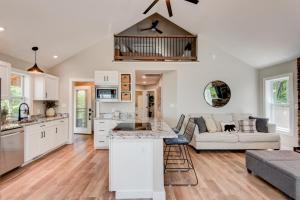 a kitchen and living room with a couch at Lessons from Mars in Banner Elk
