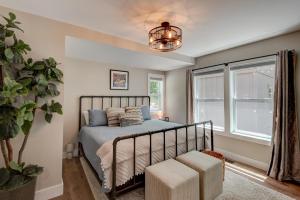 a bedroom with a bed and a potted plant at Lessons from Mars in Banner Elk