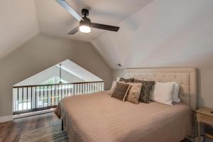 a bedroom with a bed with a ceiling fan at Lessons from Mars in Banner Elk