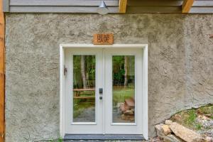 a sign above a door with a fear cave sign above it at Lessons from Mars in Banner Elk