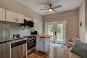 a kitchen with a stove and a ceiling fan at Lessons from Mars in Banner Elk
