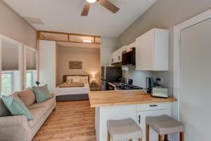 a kitchen and living room with a couch and a bed at Lessons from Mars in Banner Elk