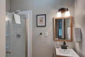 a bathroom with a sink and a mirror and a shower at Lessons from Mars in Banner Elk