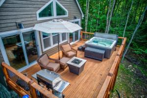 an overhead view of a deck with a hot tub at Lessons from Mars in Banner Elk