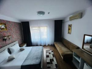 Voodi või voodid majutusasutuse Hotel Suprem toas
