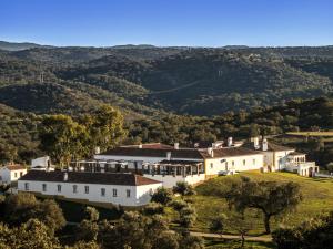 an aerial view of a large white building on a hill at Parque de Natureza de Noudar in Barrancos