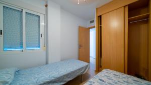 Ένα ή περισσότερα κρεβάτια σε δωμάτιο στο Piso de 2 dormitorios en El Poblet