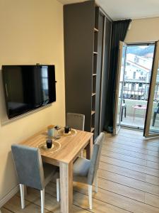 TV a/nebo společenská místnost v ubytování Saly Apart