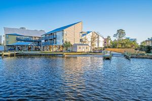 a large building next to a large body of water at Cotton Bayou B1 in Orange Beach