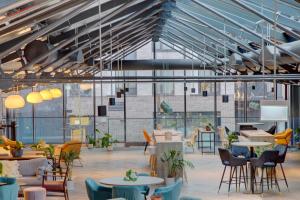 a lobby with tables and chairs and windows at Destiny Student - Ardee Point in Dublin