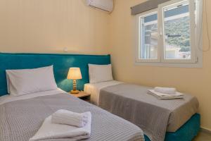 Кровать или кровати в номере BigBlue luxury apartments