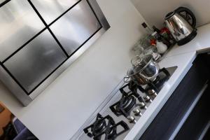 A kitchen or kitchenette at Ulivo Suites - apartments