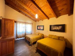 Postel nebo postele na pokoji v ubytování Cabañas Mazzatl 6 pax + 36 fotografií