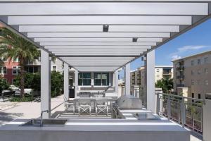 a patio with a table and a grill on a balcony at Coral Gables 1BR w WD Pool Gym nr Shops MIA-9 in Miami