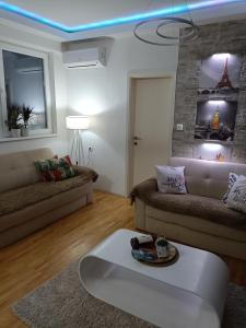 a living room with a couch and a table at Apartment in Veles