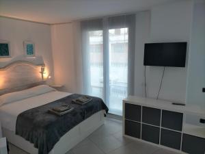 Posteľ alebo postele v izbe v ubytovaní Terraza del Bajondillo Torremolinos