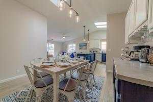 a kitchen and dining room with a table and chairs at Cozy Home, Close to Ocean and Redwoods in McKinleyville