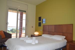 Katil atau katil-katil dalam bilik di Villa Mar i Vent