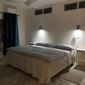 Katil atau katil-katil dalam bilik di Piscina vista al mar, Jacuzzi con agua caliente