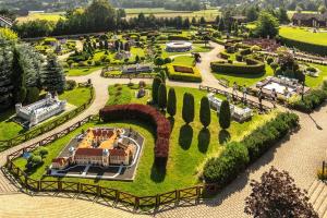 a model of a garden with a train in it at Hotel Relax in Kęty