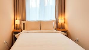 Ένα ή περισσότερα κρεβάτια σε δωμάτιο στο FilinHome Pelagica Suite