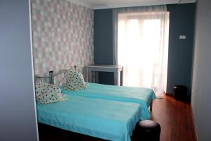 Letto o letti in una camera di Sunrise Hotel