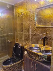 a bathroom with a sink and a toilet at Stunning 1-Bed Apartment in Dhaka close to airport in Dhaka