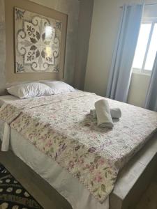 Rúm í herbergi á Curasita Colour Appartments & Resort - adres kaya Sucre nst 282