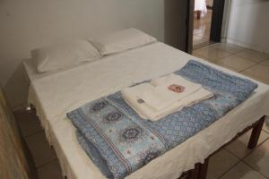 Una cama o camas en una habitación de Hotel Nossa Senhora da Conceição 57 fotos más
