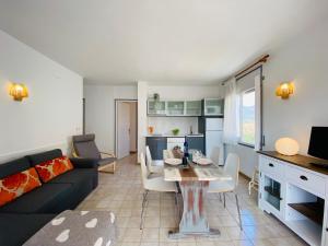 a living room with a couch and a table at Apartamentos Aquarium in Roses