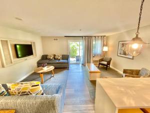 a living room with a couch and a table at The Villages at Ocean Edge Resort & Golf Club in Brewster