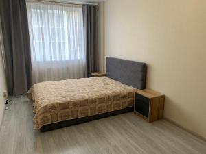 a bedroom with a bed and a television in it at Квартира ЖК 7 Небо Одесса Аквапарк Рынок-7 in Odesa