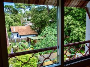 a view of a house from a window at Résidence Maminotte in La Teste-de-Buch