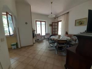 a living room with a table and chairs at Casetta Appennina (Bike Host) in Montefalcone Appennino +67 photos
