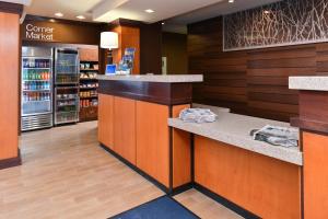 a store lobby with a counter in a store at Fairfield Inn & Suites Bloomington in Bloomington