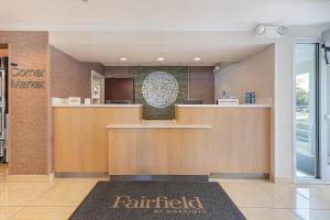 a lobby of a fairfield hospital with a counter at Fairfield Inn & Suites by Marriott Chicago Naperville in Naperville