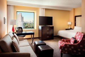 a hotel room with a bed and a television at Las Vegas Marriott in Las Vegas