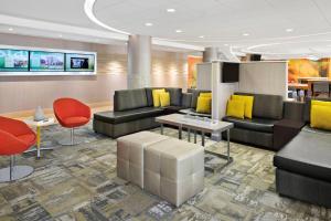 a lobby with couches and chairs and a table at SpringHill Suites by Marriott Flagstaff in Flagstaff