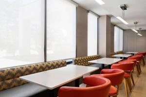 a row of tables and chairs in a restaurant at SpringHill Suites by Marriott Flagstaff in Flagstaff