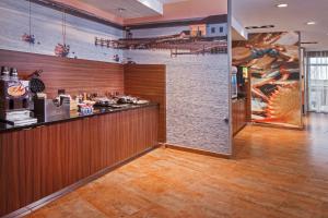 a bar in a restaurant with a mural on the wall at Fairfield Inn & Suites by Marriott Easton in Easton