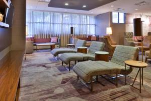 a waiting area with chairs and a waiting room at Courtyard by Marriott Ocala in Ocala